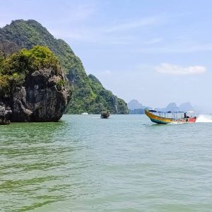 Exhilarating Longtail Boat Journey - Racing Through Phang Nga Bay's Pristine Waters Toward Hidden Island Treasures